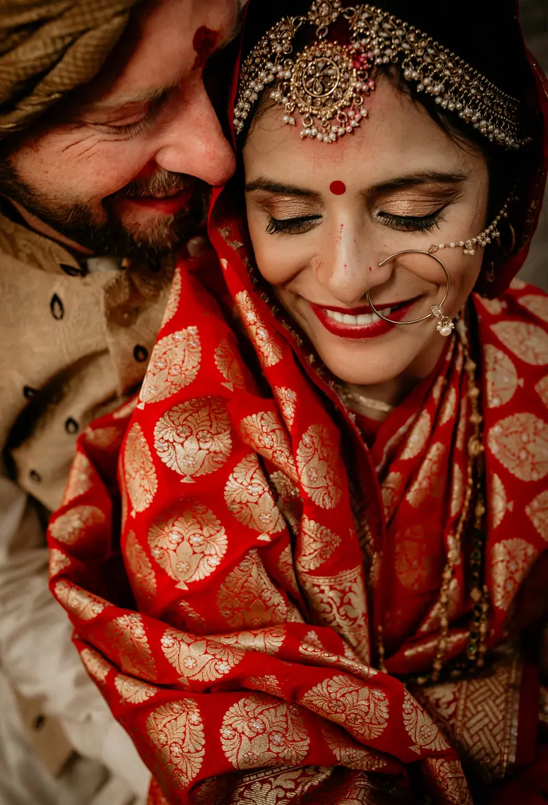 A bride under a red veil, eyes closed, mid-thought
